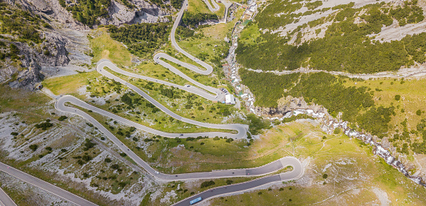 Road to the Stelvio mountain pass in Italy. Amazing aerial view of the mountain bends creating beautiful shapes