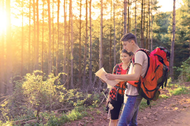 istock Couple on hiking checking on the map 1014182308