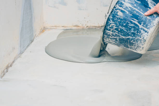 istock finishing work - the worker does the bulk floor 1014182566
