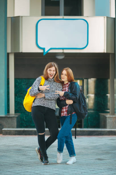 istock Text box frame and excited tenage girls 1014185826