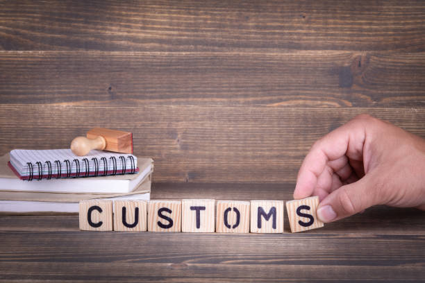 istock customs. wooden letters on the office desk 1014186092