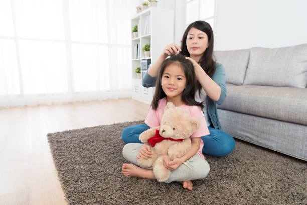 istock young pretty little daughter looking at camera 1014186140