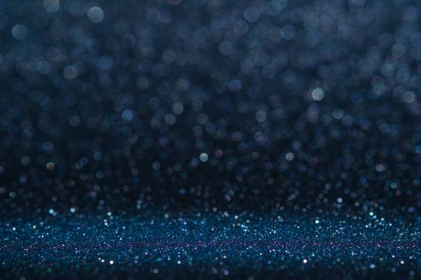 istock Abstract dark navy blue sparkling glitter wall and floor perspective background studio with blur bokeh.luxury holiday backdrop mock up for display of product.holiday festive greeting card. 1014187148