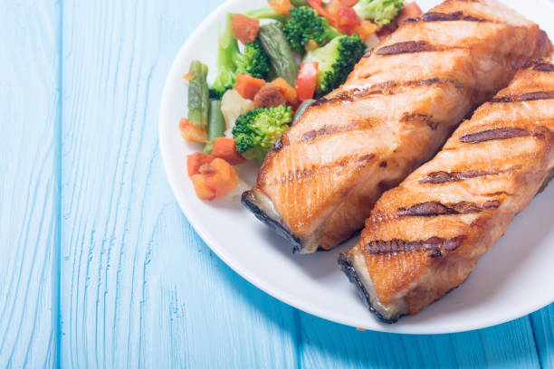 istock Grilled salmon fish with vegetables 1014189852