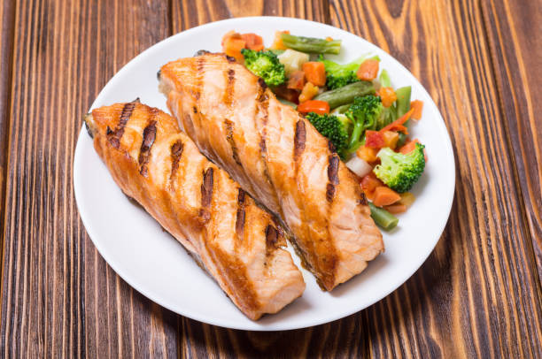 istock Grilled salmon fish with vegetables 1014189878