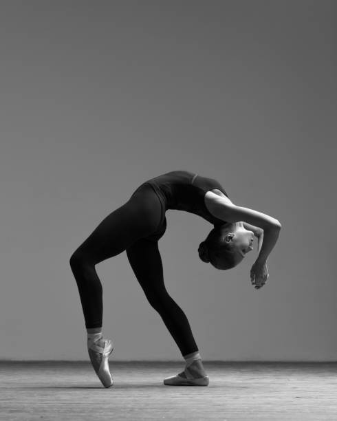 istock Young beautiful ballerina is posing in studio 1014193854