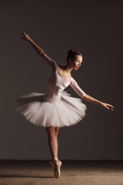 istock Young beautiful ballerina is posing in studio 1014194998