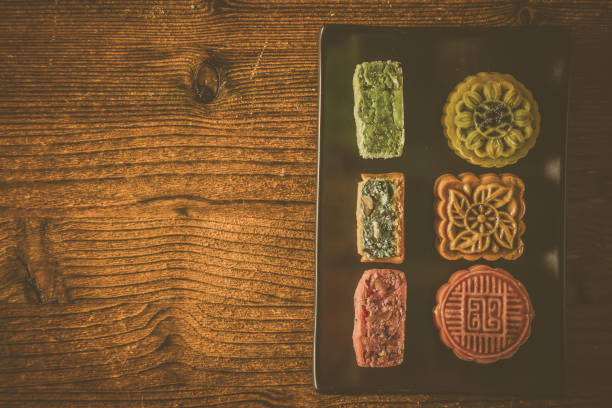 istock Mid Autumn Festival concept - yuebing monncakes on rustic background 1014198212