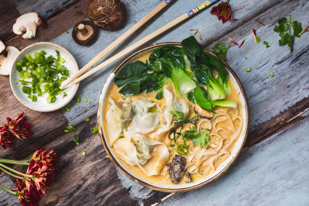 istock Chinese Noodle Soup with Yellow Curry and Wontons 1014198232