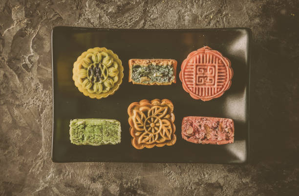 istock Mid Autumn Festival concept - yuebing monncakes on rustic background 1014198364