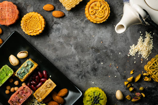 istock Mid Autumn Festival concept - yuebing monncakes on rustic background 1014198712
