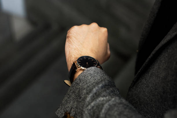 istock Man looking at his watch 1014206612