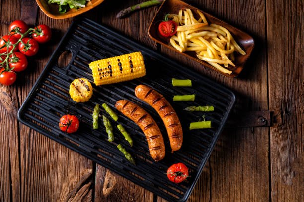 istock grilled krakauer sausage with boiled corn and green salad 1014212296