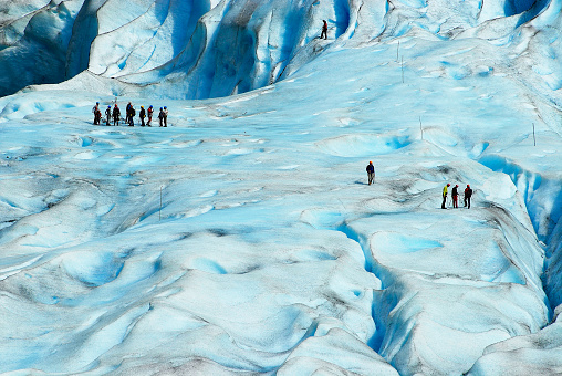 People hiking at the Jostedalsbreen glacier, the biggest glacier in continental Europe, located in Sogn og Fjordane county, Norway.