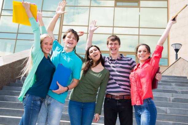 istock Happy students jumping for joy after the exam 1014215472