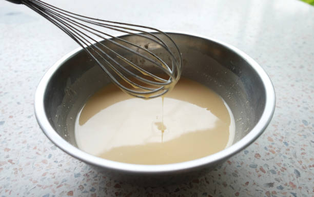 istock Mixing batter or dough for pancake or making desserts.Close up ,soft focus 1014224234
