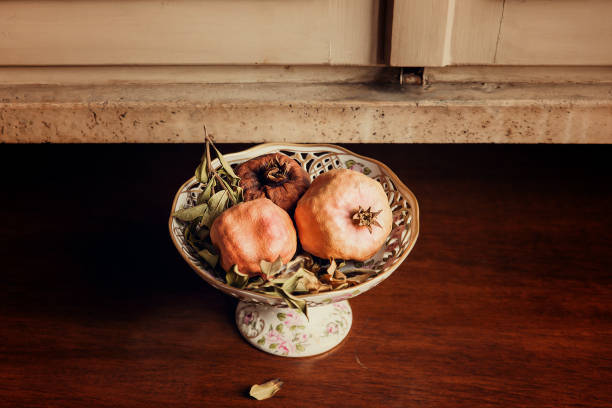 Pomegranate still life on wooden windowsill
