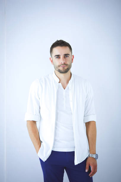 istock Young business man standing isolated on white background 1014231330