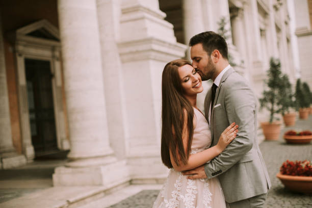 istock Young wedding couple on Capitoline hill in Rome 1014235400