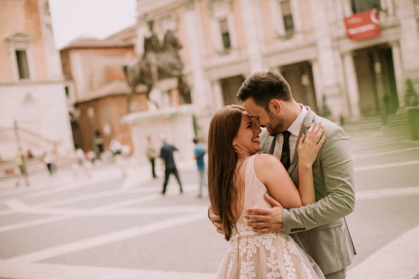 istock Young wedding couple on Capitoline hill in Rome 1014235482