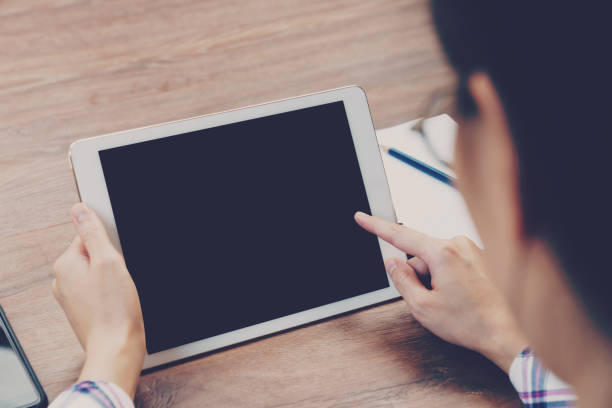istock Asian businesswoman in the cafe and using tablet on table. 1014237796