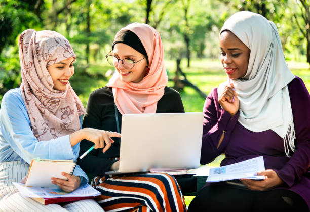 istock Group of islamic friends discussing and working together 1014238064