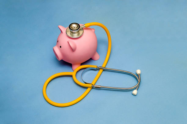 istock Piggy bank with stethoscope 1014238326