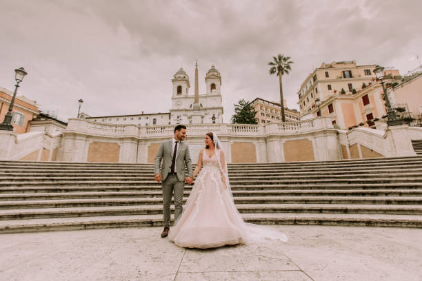 istock Young wedding couple on Spanish stairs in Rome 1014238820