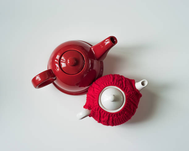 istock Red teapot and red sweater cozy teapot seen from above 1014240516
