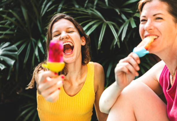 istock Mother and daughter with popsicles 1014240596