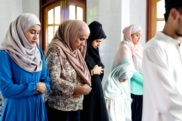 istock Muslim prayers in Qiyaam posture 1014244928
