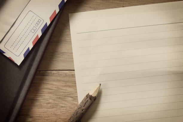 istock Notepaper and a Pencil on a Wooden Table. 1014245762