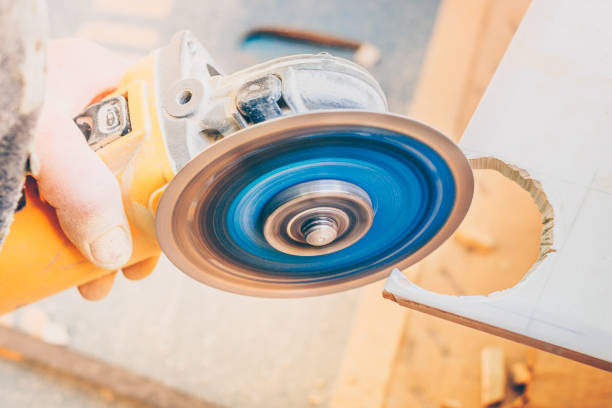 istock Finishing works - the worker works with an angle grinder with his bare hands 1014251384