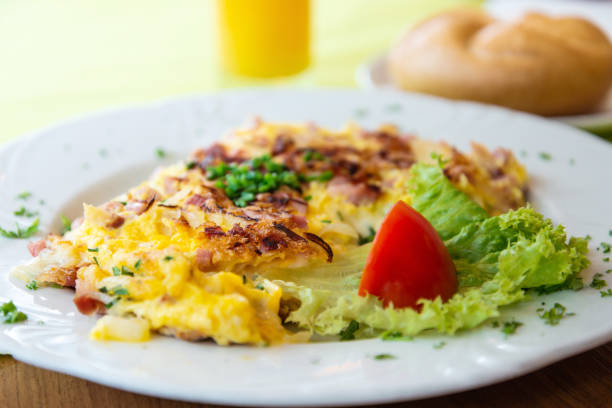 istock omelet with ham tomato and green salad 1014254142