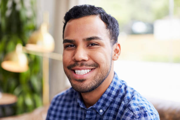 istock Young Hispanic man in coffee shop smiling to camera 1014263976