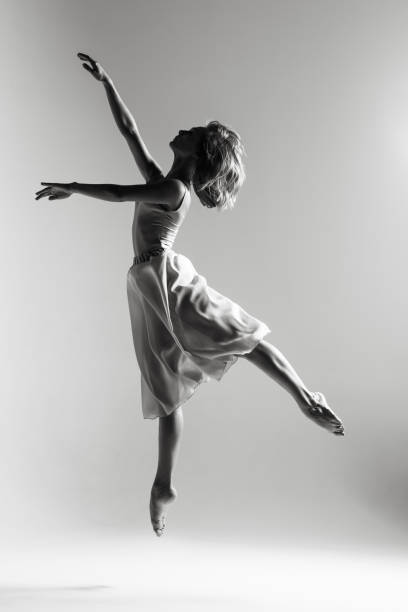 istock Young beautiful ballerina is posing in studio 1014270326
