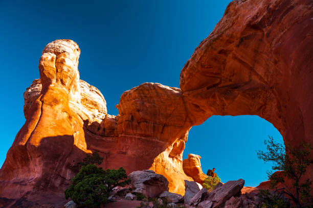 istock Hiker resting in Turret Arch 1014270838