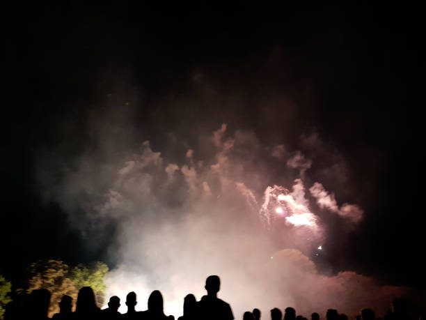 istock People look to the enlightened night sky 1014271186
