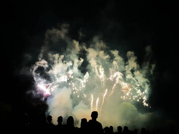 istock People look to the enlightened night sky 1014271194