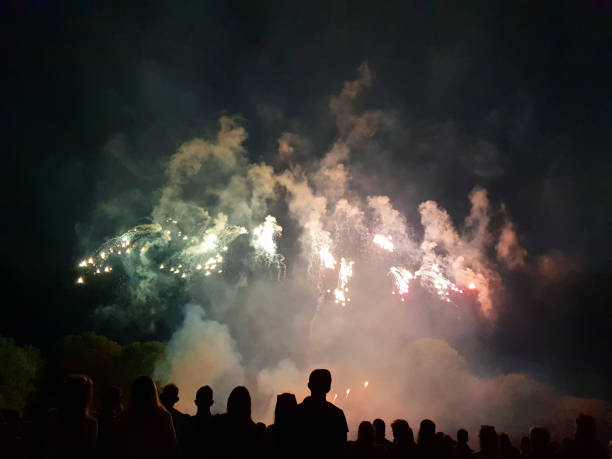istock People look to the enlightened night sky 1014271196