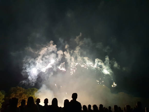istock People look to the enlightened night sky 1014271198