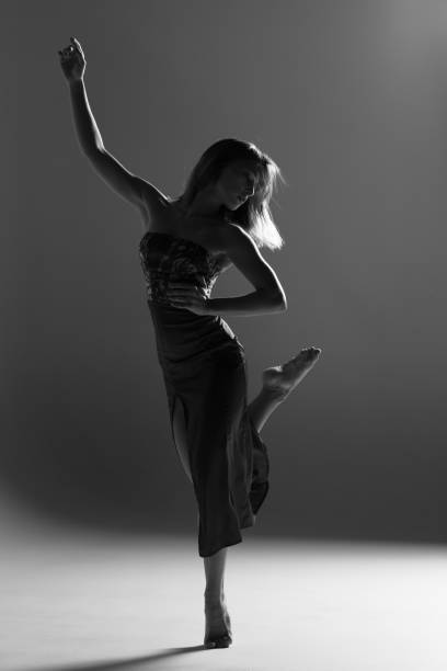istock Young beautiful ballerina is posing in studio 1014271318
