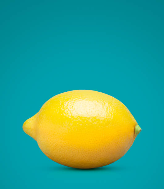 istock Perfect yellow lemon on turquoise with clipping path 1014271642