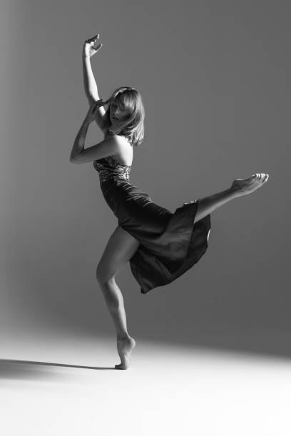 istock Young beautiful ballerina is posing in studio 1014271754