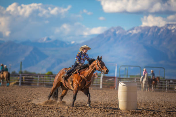 istock Young cowboy barrel racing rodeo 1014271816