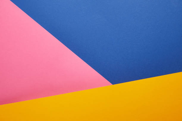 istock geometrical texture with blue, pink and yellow papers 1014272076