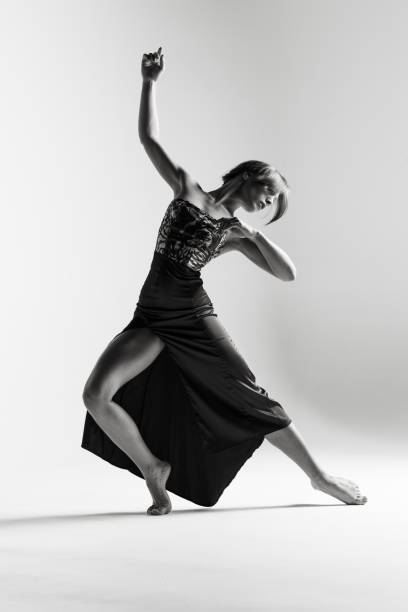istock Young beautiful ballerina is posing in studio 1014272176