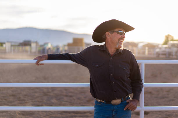 istock Cowboy leaning on a fence at a rodea arena 1014272244