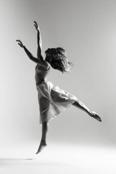 istock Young beautiful ballerina is posing in studio 1014272382