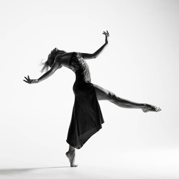 istock Young beautiful ballerina is posing in studio 1014272596